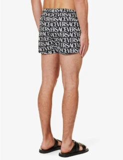Versace Brand-typography Slip-pocket Regular-fit Swim Shorts 9 Versace Brand-typography Slip-pocket Regular-fit Swim Shorts -Baker Klein Shop R04188866 GOLDPRINT ALT03